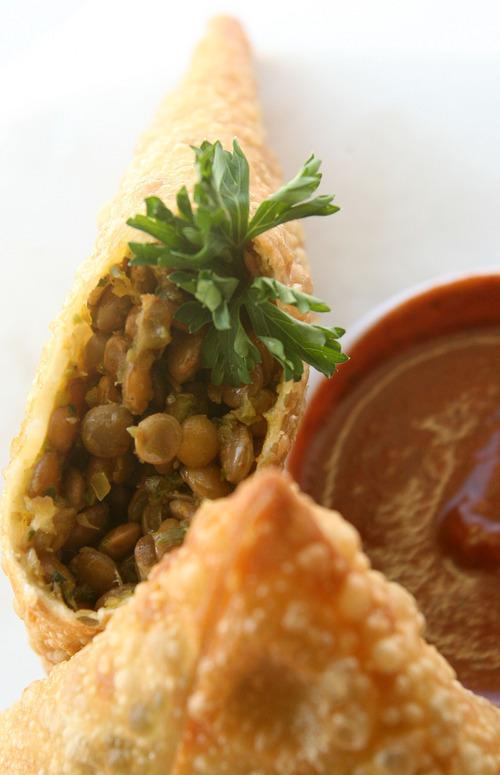 Leah Hogsten  |  The Salt Lake Tribune
Yemisir sambusa, a dish of two hand-wrapped pastry shells filled with lentils, onions, scallions, peppers and herbs, served at the Blue Nile Ethiopian Restaurant.