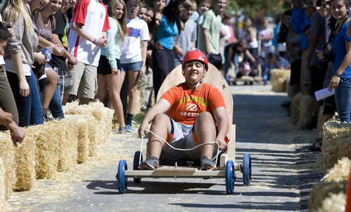 Paul Fraughton | The Salt Lake Tribune
Shabir Aminzada, a Rowland Hall sophomore, guides his team's gravity car through a hay bale lined course. The cars, built by the students earlier in the day, were part of a science lesson dealing with potential and kinetic energy. The event was part of the school's 