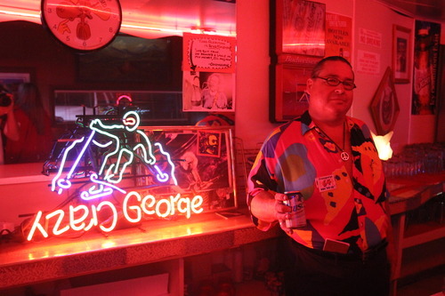 Rick Egan  | The Salt Lake Tribune 

Kitty Pappas' son, waiter Crazy George, says he earned the nickname, enshrined in one of the restaurant's neon signs, for his habit of wearing shorts despite the temperature. George has been serving his mother's food for 30 years at the Kitty Pappas Steak House in Woods Cross.