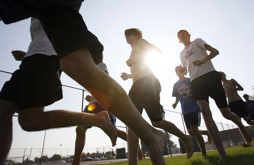 Francisco Kjolseth  |  The Salt Lake Tribune
American Fork is one of the top cross country programs in the state as the team recently cools down with a barefoot run around school before the start of the cross country season under coach Timo Mostert.