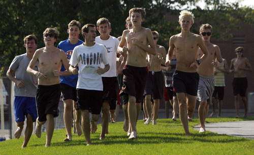 Francisco Kjolseth  |  The Salt Lake Tribune
American Fork is one of the top cross country programs in the state as the team recently cools down with a barefoot run around school before the start of the cross country season under coach Timo Mostert.