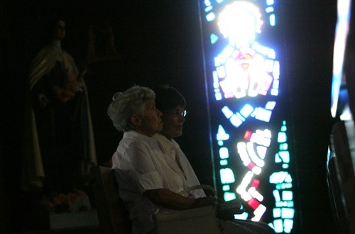 Tribune file photo
Women enjoy a quiet moment of prayer and reflection in the chapel at the Carmelite Monastery during a past Carmelite fair.