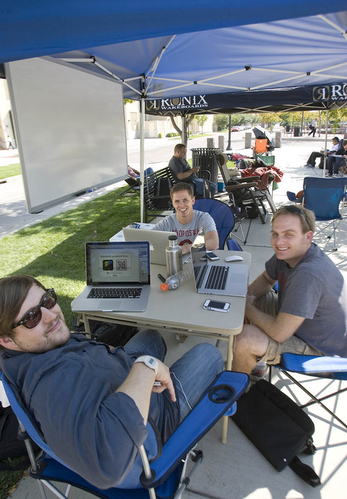 Paul Fraughton | The Salt Lake Tribune
Joe Wilson (front), Jonathan Lund and Spencer Smith (right), spend their time waiting in line for the new iPhone 5 by developing applications that can be used on the new phone.

 Thursday, September 20, 2012