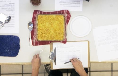 Kim Raff | The Salt Lake Tribune
A judge gets ready to taste Laurie Willburg's entry in the Funeral Potato Contest at the Utah State Fair in Salt Lake City earlier this month. Willberg went on to win the contest.