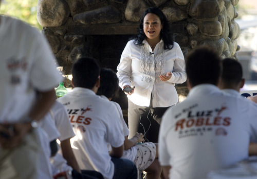 Kim Raff | The Salt Lake Tribune
State Sen. Luz Robles, D-Salt Lake City, talks to volunteers during a Latino voter outreach event in Riverside Park in Salt Lake City on Wednesday evening.