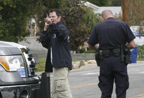 Scott Sommerdorf  |  The Salt Lake Tribune             
Unified Police respond to a report of a man barricaded in his home with possible explosives at 3128 Del Mar in Millcreek, Sunday, September 23, 2012.