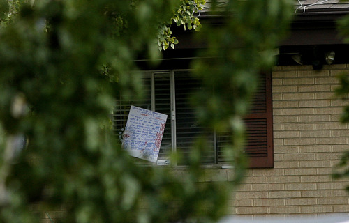 Scott Sommerdorf  |  The Salt Lake Tribune             
A note scrawled with writings by David Charles Baker was taped to his window as he was inside barricaded. Unified Police respond to a report of a man barricaded in his home with possible explosives at 3128 Del Mar in Millcreek, Sunday, September 23, 2012.