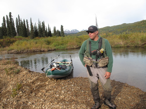 Mike Overcast, operations manager of the Tordrillo Mountain Lodge in Alaska, prepares to lead a group of anglers down Talachulitna Creek armed with colorful flies and a bear gun. 
| Brett Prettyman/The Salt Lake Tribune