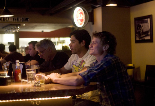 Kim Raff | The Salt Lake Tribune
People hang out at the bar at Bourbon House in Salt Lake City.