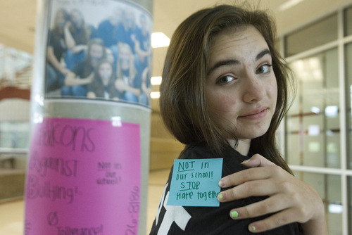 Paul Fraughton | The Salt Lake Tribune
Rylee Steyee, a ninth-grader and student ambassador at Sunset Ridge Middle School, shows off one of the Post-it notes worn by students with a positive message against bullying. The notes were a reaction to an incident at the school where a new student had a note saying 
