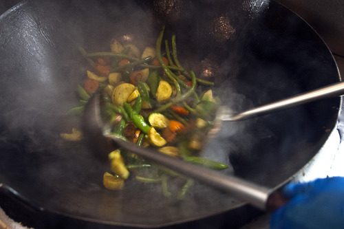 Chris Detrick  |  The Salt Lake Tribune
Lead wok chef Ed Wong makes vegetable stir-fry at Harmons City Creek Wednesday September 26, 2012.