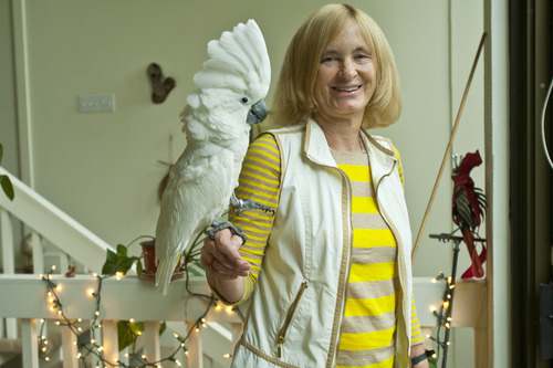 Chris Detrick  |  The Salt Lake Tribune
University of Utah professor of anthropology Polly Wiessner poses for a portrait with her cockatoo at her home Tuesday September 25, 2012.