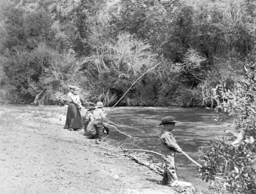 Young boy and his family fishing. Courtesy of Utah Historical Society