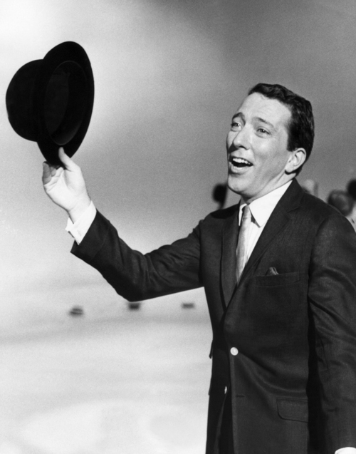 FILE - In a May 12, 1961 file photo, Andy Williams performs a song on a television show. Emmy-winning TV host and 