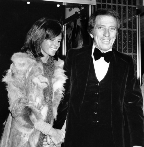 FILE - In a Dec. 19, 1974 file photo, American singer Andy Williams and his wife Claudine Longet, shown upon arrival at the Odeon, Leicester Square, London, for the Royal Charity World premiere of 