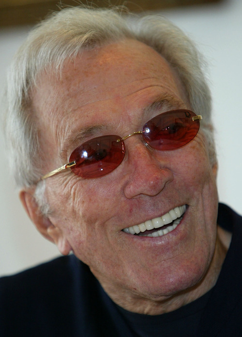 FILE - In this July 25, 2004 file photo, U.S. singer Andy Williams smiles as he speaks to reporters during his news conference at a Tokyo hotel. Emmy-winning TV host and 