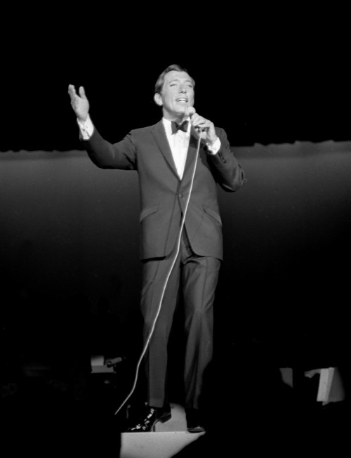 In this Aug. 5, 1966 photo provided by the Las Vegas News Bureau, Andy Williams performs at Caesars Palace in Las Vegas.  Andy Williams, whose hit recording 