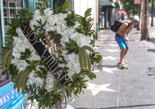 Flowers are left at the star of performer Andy Williams star on the Hollywood Walk of Fame in Los Angeles, Wednesday, Sept. 26, 2012. Williams, who had a string of gold albums and hosted several variety shows and specials such as, 