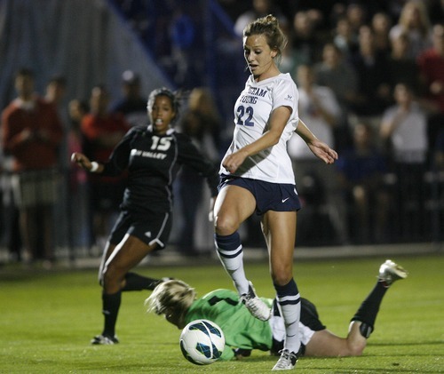 Paul Fraughton | Salt Lake Tribune
 BYU's Jessica Ringwood gets to the ball before UVU's keeper Lauren Sack and kicks the ball into the back of the net for a BYU goal.BYU played Utah Valley University at BYU's field.

 Thursday, September 27, 2012