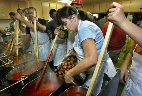 Scott Sommerdorf  |  The Salt Lake Tribune
Amy Sheddon, center, delivers freshly cooked Colosimo sausage into the spaghetti sauce being stirred by the volunteers in 2009. Our Lady of Lourdes Catholic Church in Magna has hosted its annual spaghetti dinner fund-raiser for 78 years, just two years shy of the 80 years Magna's sole Catholic church has served area parishioners. This year's 78th annual church fund-raiser will raise funds for a new church roof, as well as community outreach programs.