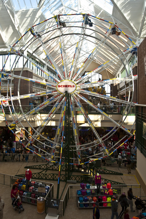 Chris Detrick  |  The Salt Lake Tribune
The Ferris wheel at Scheels Saturday September 29, 2012. Scheels opened its 220,000-square-foot mega-sporting goods store in Sandy. Featuring a 16-car Ferris wheel rising toward a skylight, a 16,000-gallon double-arched salt water aquarium, a boating department, game centers and a focus on fashionable apparel, the store is meant to be a fun destination, said Dan Hermanson, an assistant store leader.