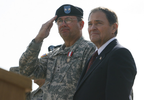 Scott Sommerdorf  |  The Salt Lake Tribune             
Maj. Gen. Brian L. Tarbet salutes troops passing in review with Utah Governor Gary Herbert. After 12 years the adjutant general of the Utah National Guard, Maj. Gen. Brian L. Tarbet, relinquished command to Maj. Gen. Jefferson S. Burton at a ceremony on the field named for Tarbet, Saturday, September 29, 2012.