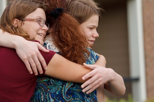 Trent Nelson  |  The Salt Lake Tribune
Garrett Lines, right, and his sister Kiercy embrace their mother, Nikki Lines in Midvale on Thursday, Sept. 6, 2012.  Garrett has autism and lives in a group home after his mother turned him over to the child welfare system a few years ago.