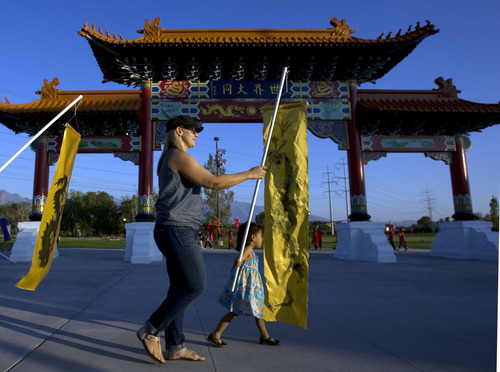 Kim Raff | The Salt Lake Tribune
Children from five different area schools who are part of the Chinese emersion program march around the Chinese Heritage Gate during an unveiling at the Utah Cultural Center in West Valley City on Sept, 29, 2012. The gate, which is symbol of friendship between West Valley City and Nantou, Taiwan has come under scrutiny with some members of the Asian community who are upset about how the money has been handled.