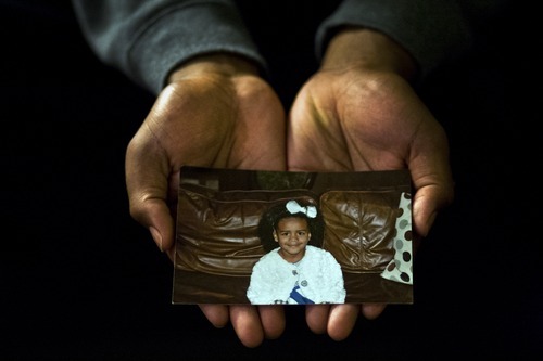 Chris Detrick  |  The Salt Lake Tribune
Utah defensive lineman Nate Fakahafua holds a photograph of his daughter Lily when she was 3 years old.