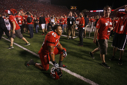 Scott Sommerdorf  |  The Salt Lake Tribune             
Utah Utes defensive end Jacoby Hale (40) is stunned as he kneels when the call is made that the fans had been penalized for rushing the field too soon, and BYU was given more time on the clock. Utah defeated BYU 24-21, Saturday, September 15, 2012.