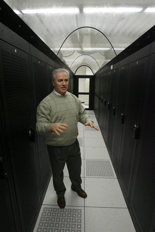 Lindon - Dave Jenkins, VP of Marketing and Business Development for C7 formerly known as Center 7 Inc., shows off a cold row, a climate controlled corridor of servers in the new Data Center on Thursday, Jan. 8, 2008, which provides a secure site for other companies computer systems and also provides backup services and other online services to companies.  Photo by Francisco Kjolseth/The Salt Lake Tribune 01/08/2009