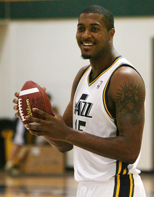 Steve Griffin | The Salt Lake Tribune


Jazz forward Derrick Favors holds a football after catching a pass from new Jazz guard, Mo WIlliams, during Jazz media day in Salt Lake City on Oct. 1, 2012.