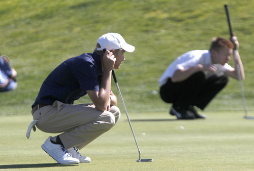 Al Hartmann  |  The Salt Lake Tribune
Syracuse High School's Cameron Spever, left and Lone Peak High School's Cameron Webb line up their putts during the final round of the 5A Boys Golf High School State Championship at River Bend Golf Course in  Riverton.
