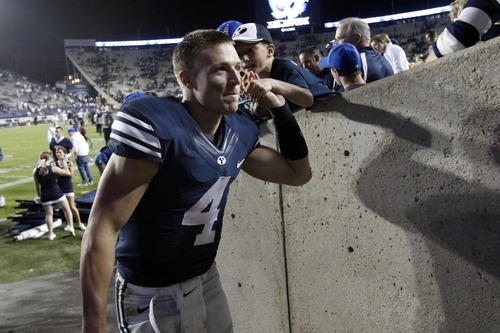 Chris Detrick  |  The Salt Lake Tribune
Brigham Young Cougars quarterback Taysom Hill (4) greets fans after the game at LaVell Edwards Stadium Friday September 28, 2012. BYU won the game 47-0.