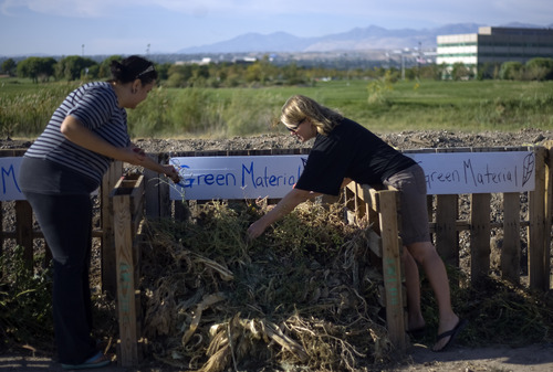 Kim Raff | The Salt Lake Tribune
(right) Garden director Stacy Perkins andJessica McKelvie sort compost in the garden at Dancing Moose Montessori School that was created with the help of Probar, an organic snack company in West Valley City, Utah on September 14, 2012.