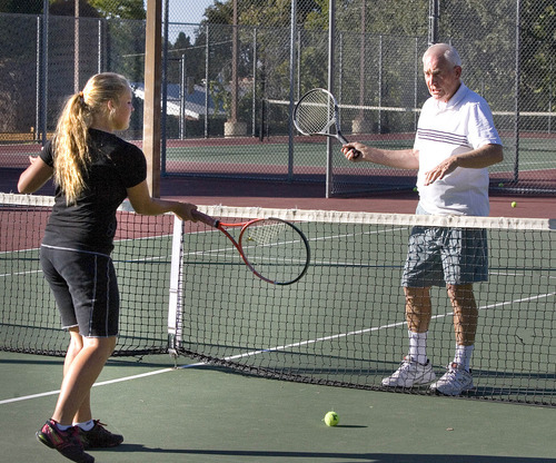 Paul Fraughton | Salt Lake Tribune
Olympus High tennis coach Kevin Watts works with Haleigh Bowning at a recent practice,

 Tuesday, October 2, 2012