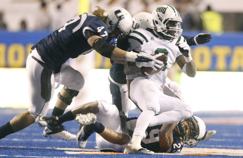 Chris Detrick  |  The Salt Lake Tribune
Ohio Bobcats running back Donte Harden (8) is tackled by Utah State Aggies defensive end Levi Koskan (47), safety Alfred Bowden (29) and cornerback McKade Brady (36) during the second half of the Famous Idaho Potato Bowl at Bronco Stadium on Dec. 17, 2011. Ohio won the game 24-23.