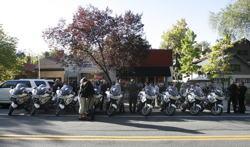 Francisco Kjolseth  |  The Salt Lake Tribune
Members of the Salt Lake Police Department gather at 564 E. Third Ave. in Salt Lake City on Thursday, October 4, 2012, to dedicate a plaque commemorating fallen Officer Percy Clark, killed during an armed robbery in 1973, when the current business used to be a pharmacy.