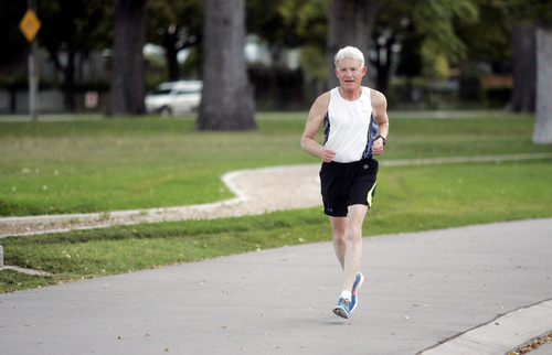 Ashley Detrick  |  The Salt Lake Tribune
Jim Michie, 74, runs one of his last training runs around Liberty Park on Wednesday, Oct. 3, 2012, in preparation for the St. George Marathon this weekend. His three mile run around the park was at his marathon pace of 9:09, which will put him finishing right around 4 hours.
This marathon will be Michie's 50th since he started running 34 years ago.