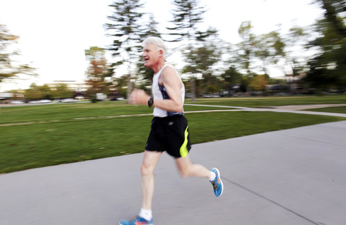 Ashley Detrick  |  The Salt Lake Tribune
Jim Michie, 74, runs one of his last training runs around Liberty Park on Wednesday, Oct. 3, 2012, in preparation for the St. George Marathon this weekend. His three mile run around the park was at his marathon pace of 9:09, which will put him finishing right around 4 hours.
This marathon will be Michie's 50th since he started running 34 years ago.