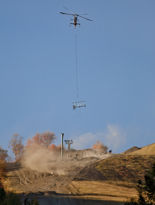 Michael Mangum  |  Special to the Tribune

Dust kicks up under rotor wash from a Kaman K-1200 helicopter as it hoists ski lift assembly parts up the mountain at Sundance Resort on Friday, October 5, 2012. Crews worked to build the new, yet-to-be-named lift, which is expected to be operational on Dec. 7.