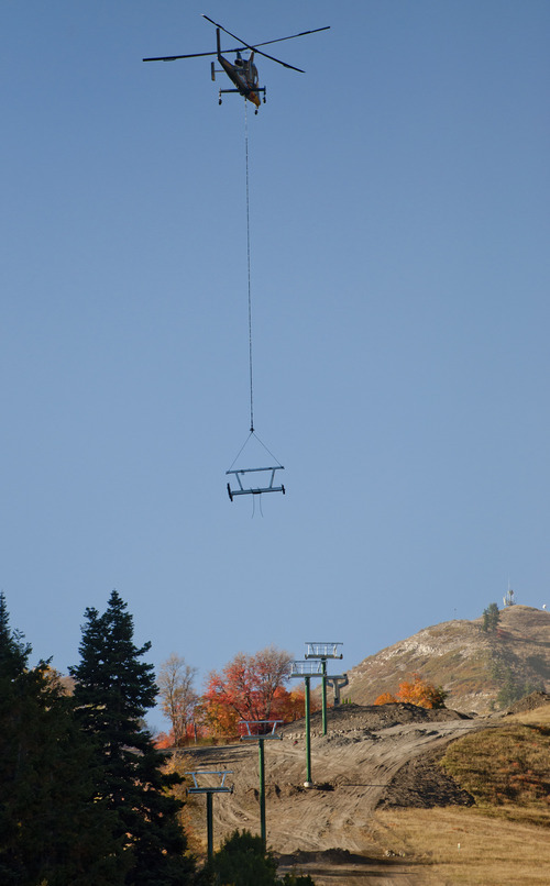 Michael Mangum  |  Special to The Salt Lake Tribune

A Kaman K-1200 helicopter lowers a ski lift assembly at Sundance Resort on Friday, October 5, 2012. Crews worked to build the yet-to-be-named lift this morning and it's expected to be operational by Dec. 7.