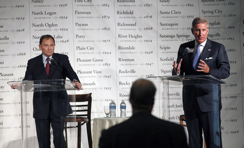 Gov. Gary Herbert and challenger Peter Cooke in their second debate on Thursday expressed fundamental disagreement on the expansion of Medicaid. This file photo was from their first debate before the Utah League of Cities and Towns.