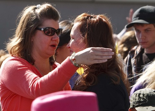 Leah Hogsten  |  The Salt Lake Tribune
Kathy Newbold, left, and Lani Allen hug during a memorial and dedicatory service, to their children Friday, October 5 2012 in West Jordan. West Jordan Elementary School students, teachers and staff joined members of the community in a memorial ceremony for two West Jordan Elementary students who passed away recently. A tree, memorial bench and plaques were dedicated for Sierra Newbold and Daniel Allen outside at the school.