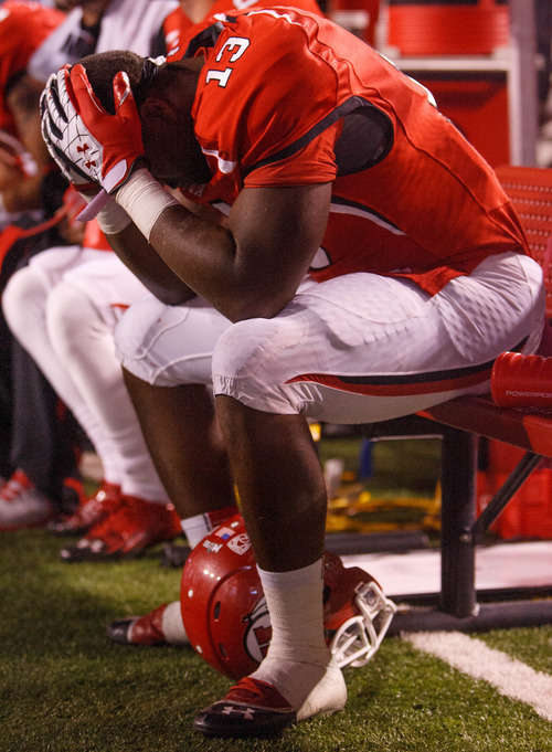 Trent Nelson  |  The Salt Lake Tribune
Utah running back Kelvin York (13) holds his head in his hands in the final seconds of the loss to USC on Oct. 4, 2012 at Rice-Eccles Stadium in Salt Lake City.