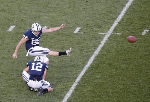 Chris Detrick  |  The Salt Lake Tribune
Brigham Young Cougars punter Riley Stephenson (99) kicks a point after touchdown during the first half of the game at LaVell Edwards Stadium Friday September 28, 2012.