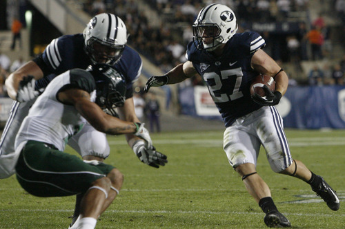 Chris Detrick  |  The Salt Lake Tribune
Brigham Young Cougars running back David Foote (27) runs the ball during the second half of the game at LaVell Edwards Stadium Friday September 28, 2012. BYU won the game 47-0.
