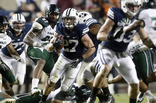 Chris Detrick  |  The Salt Lake Tribune
Brigham Young Cougars running back David Foote (27) runs the ball during the second half of the game at LaVell Edwards Stadium Friday September 28, 2012. BYU won the game 47-0.
