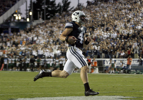 Chris Detrick  |  The Salt Lake Tribune
BYU quarterback Taysom Hill scores a touchdown during the the game against Hawaii at LaVell Edwards Stadium on Sept. 28, 2012.