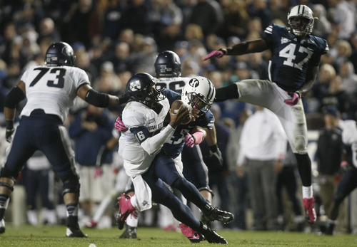 Chris Detrick  |  The Salt Lake Tribune
Utah State Aggies quarterback Chuckie Keeton (16) is sacked by Brigham Young Cougars linebacker Tyler Beck (45) during the second half of the game at LaVell Edwards Stadium Friday October 5, 2012. BYU won the game 6-3.